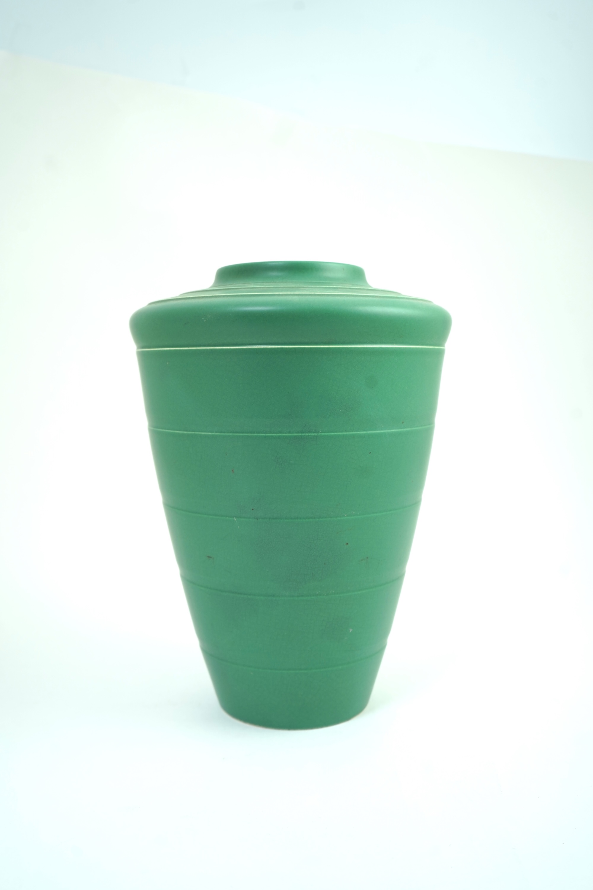 Keith Murray MC RDI FRIBA (New Zealand/British, 1892-1981) for Wedgwood: A matt green glazed tapering vase